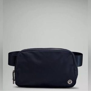 Brand new, with tags. Navy blue lululemon belt bag.